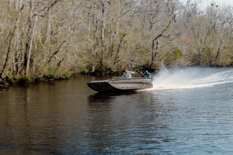 Slide: The Image of 2026 Havoc 1756 MSTC boat speeding on a river surrounded by trees. - 8