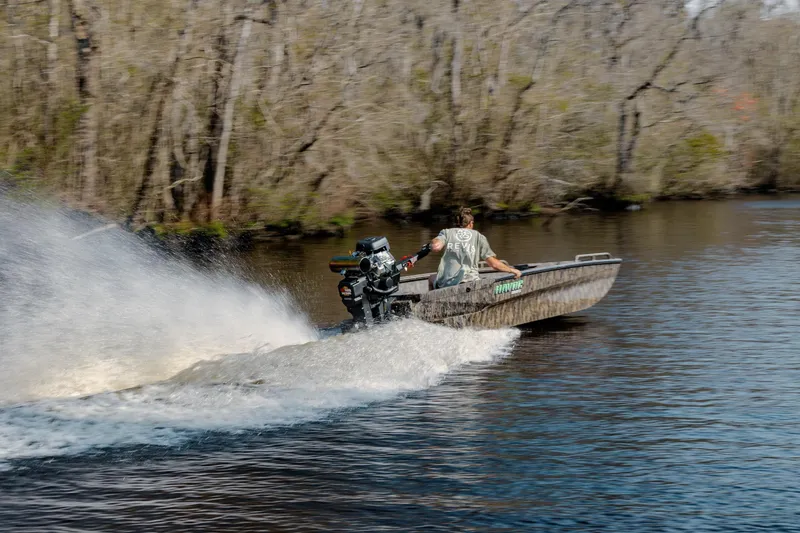 Slide: The Image of Man driving 2026 Havoc 1756 MSTC boat at high speed on a river. - 9