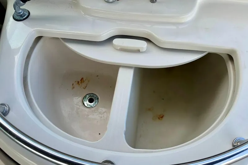 Slide: The Image of Storage compartment on a 2004 Sea Ray 270 Sundeck boat. - 20