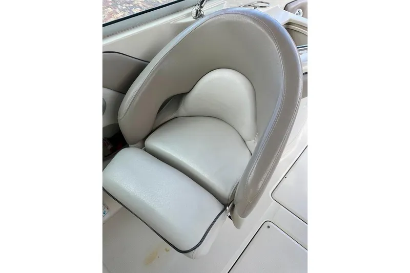Slide: The Image of Gray leather seat on a 2004 Sea Ray 270 Sundeck boat. - 26