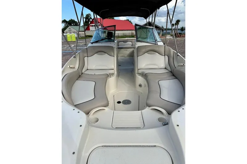 Slide: The Image of 2004 Sea Ray 270 Sundeck interior with spacious seating and canopy. - 9