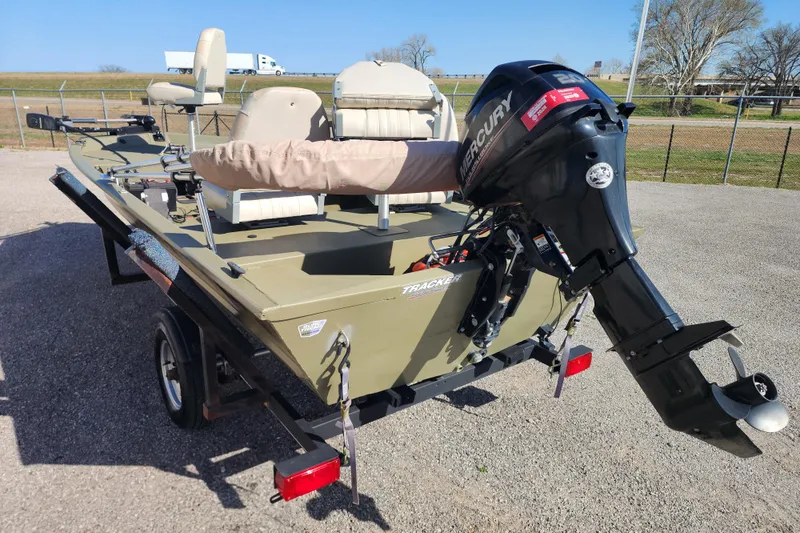 Slide: The Image of 2017 Tracker Grizzly 1648 SC boat with Mercury outboard motor on trailer. - 4