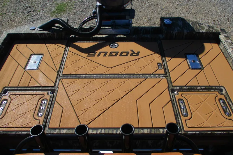 Slide: The Image of 2026 Avid 22 Rogue CC boat deck with geometric patterns and storage compartments. - 11
