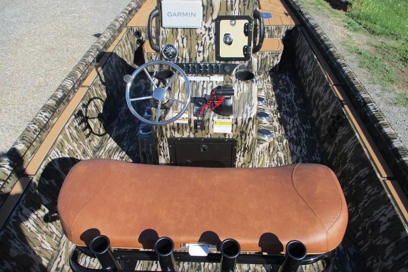 Slide: The Image of Interior of 2026 Avid 22 Rogue CC boat with camouflage design and Garmin equipment. - 14