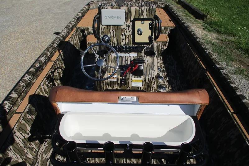 Slide: The Image of Interior of 2026 Avid 22 Rogue CC boat with camouflage design and Garmin navigation system. - 15