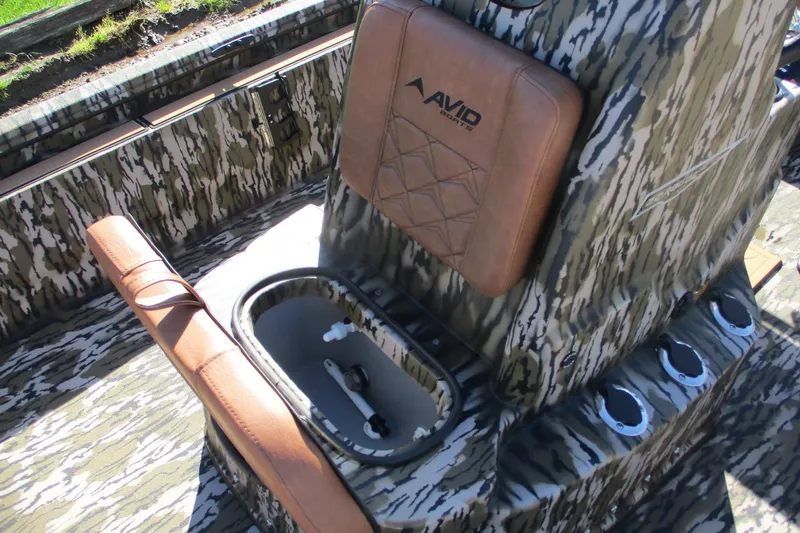 Slide: The Image of 2026 Avid 22 Rogue CC boat interior with camouflage design and leather seating. - 18