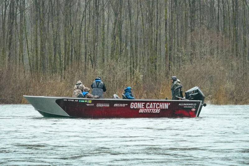 The Image of Fishing boat Alumaweld Columbia XL 26 on a river, surrounded by trees, 2026 model. - 0