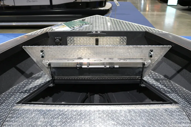Slide: The Image of 2026 Alumaweld Columbia XL 26 boat with open storage compartment, diamond plate flooring. - 14