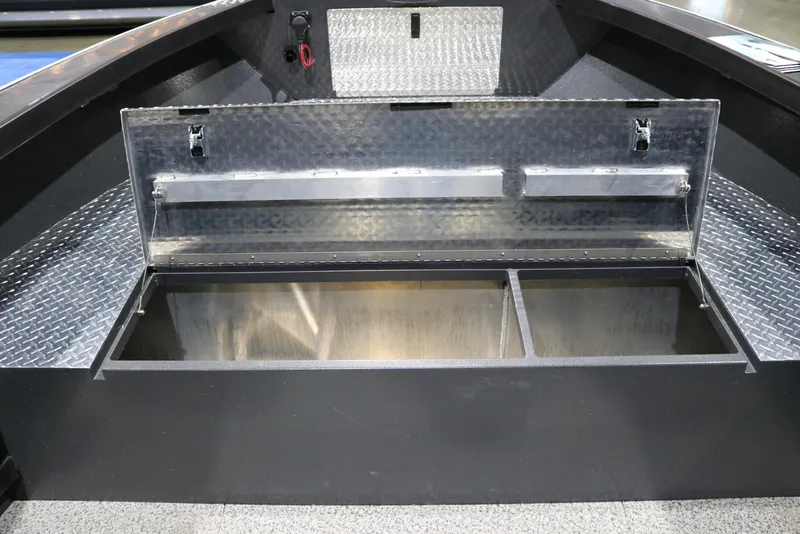 Slide: The Image of Storage compartment of 2026 Alumaweld Columbia XL 26 boat, featuring diamond plate design. - 16