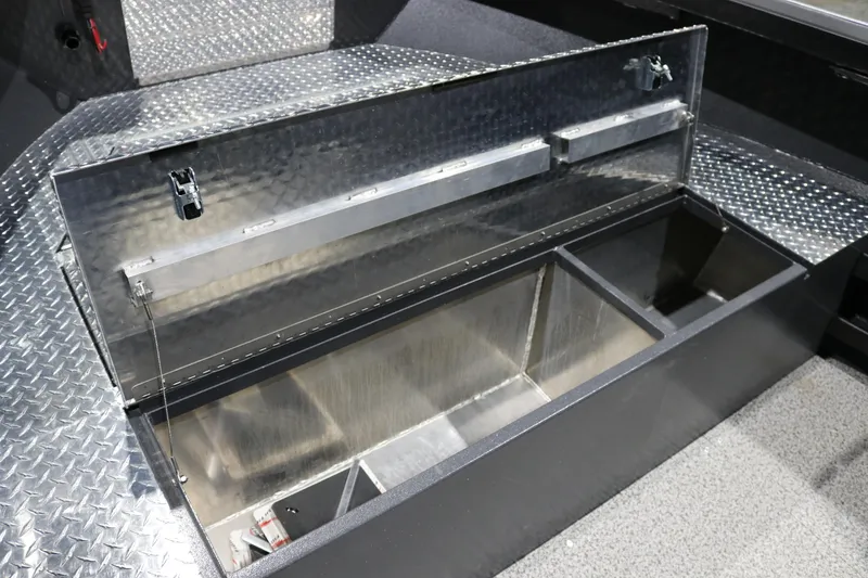 Slide: The Image of Alumaweld Columbia XL 26 (2026) boat storage compartment with diamond plate finish. - 17