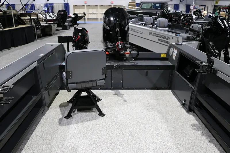 Slide: The Image of 2026 Alumaweld Columbia XL 26 boat interior with seating and motor display. - 18