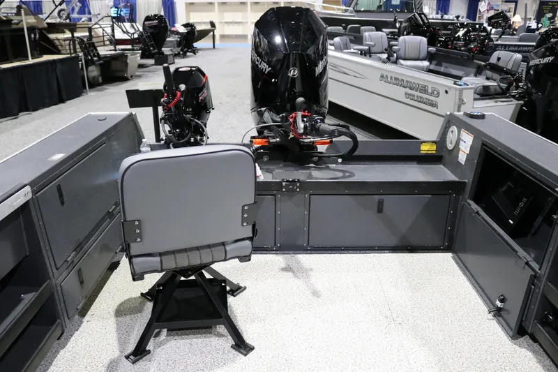 Slide: The Image of 2026 Alumaweld Columbia XL 26 boat interior with Mercury outboard motor and seating. - 19