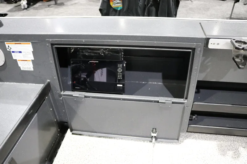 Slide: The Image of 2026 Alumaweld Columbia XL 26 boat dashboard with electronic display and storage compartment. - 20