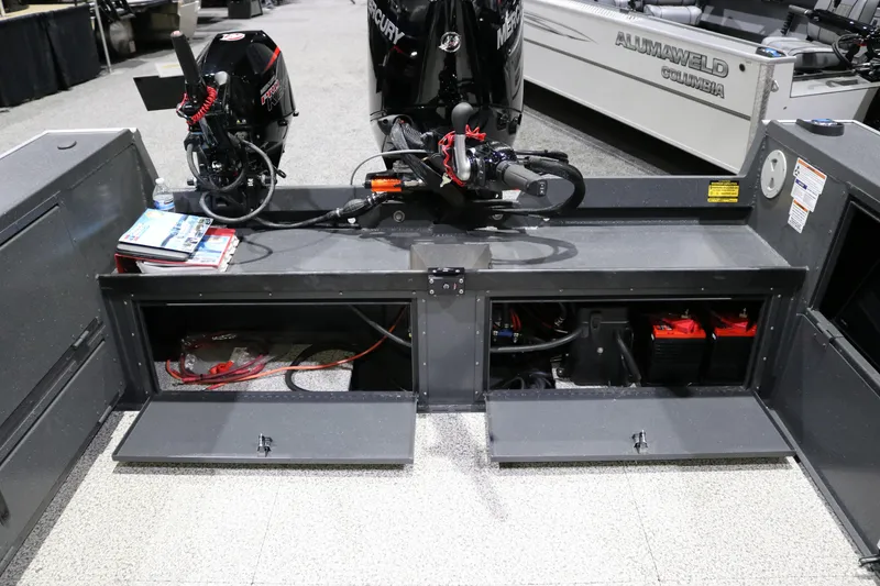 Slide: The Image of 2026 Alumaweld Columbia XL 26 boat interior with Mercury engines and storage compartments. - 22