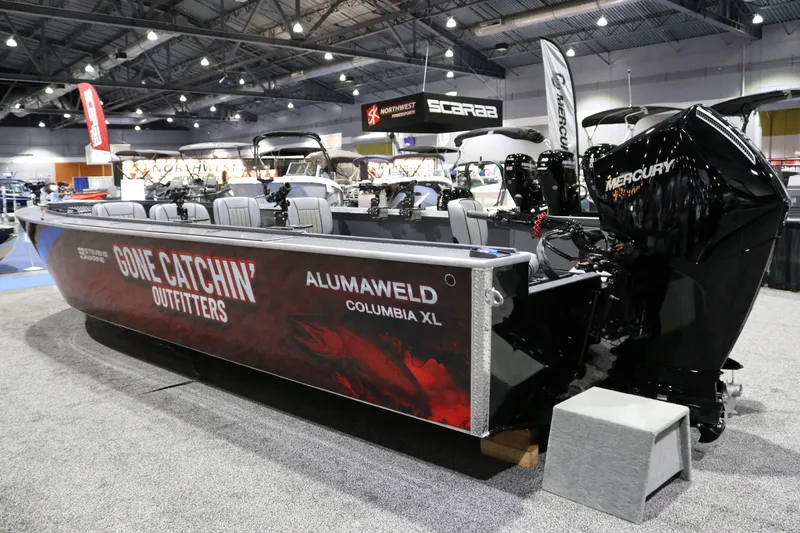 Slide: The Image of 2026 Alumaweld Columbia XL 26 boat displayed at a trade show with Mercury engine. - 27