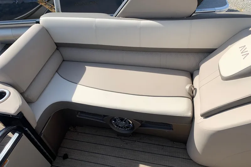Slide: The Image of 2024 Avalon Catalina Quad Lounge interior seating with beige upholstery and integrated speaker. - 12