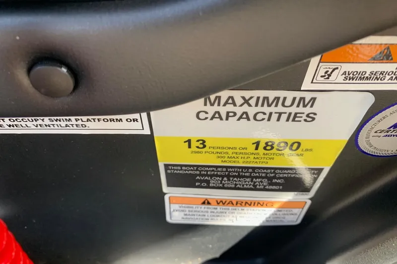 Slide: The Image of 2024 Avalon Catalina Quad Lounge capacity label, 13 persons or 1890 lbs, safety warnings visible. - 14