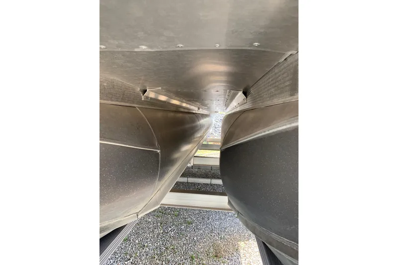 Slide: The Image of Underneath view of 2024 Avalon Catalina Quad Lounge pontoon boat, showcasing aluminum pontoons. - 23