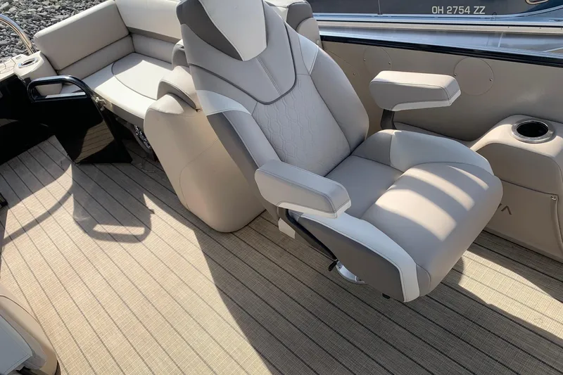 Slide: The Image of Luxurious seating on 2024 Avalon Catalina Quad Lounge boat, featuring plush upholstery and modern design. - 8