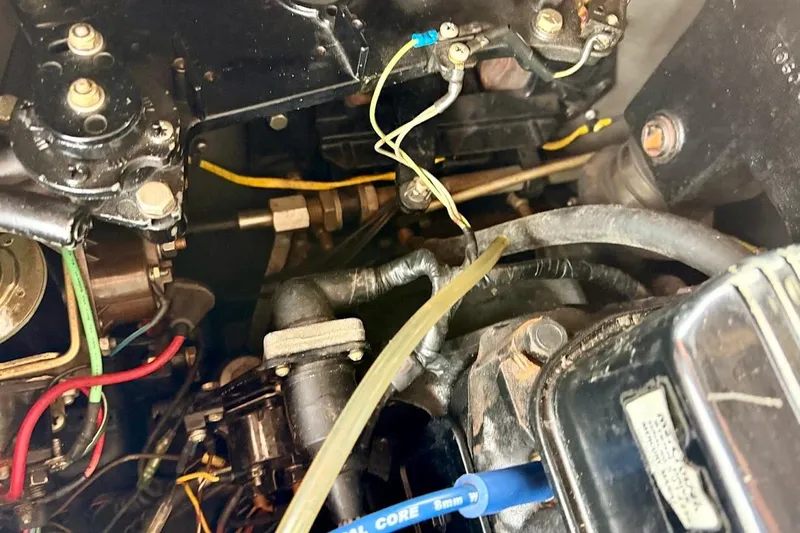 Slide: The Image of Close-up of a 1981 Glaston/Carlson C-512 engine with visible wiring and components. - 26