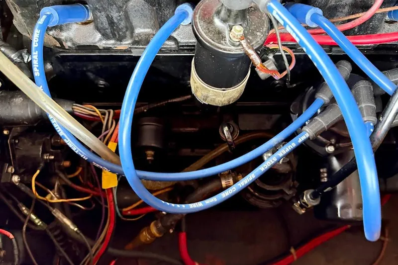 Slide: The Image of Engine compartment of a 1981 Glaston/Carlson C-512 with blue ignition wires. - 27