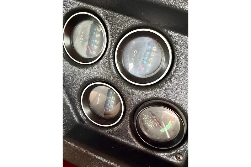 Slide: The Image of Close-up of 1981 Glaston/Carlson C-512 dashboard gauges, showing temperature, oil, and fuel levels. - 39