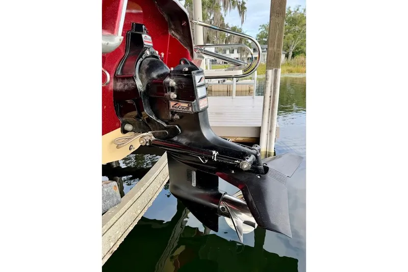 Slide: The Image of 1981 Glaston/Carlson C-512 boat motor, docked by a wooden pier. - 8