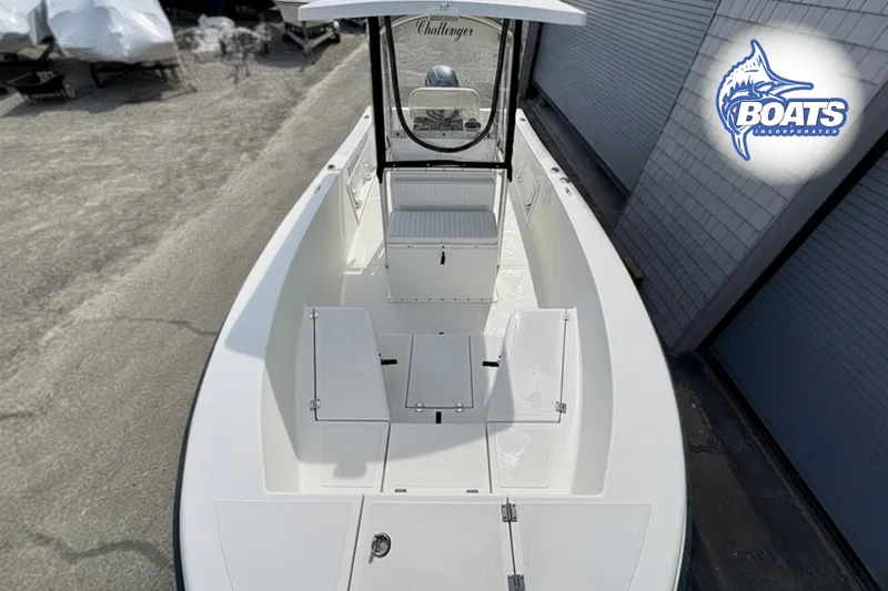 Slide: The Image of 2018 KenCraft Challenger 206 boat, white interior, center console, docked near Boats Incorporated logo. - 3