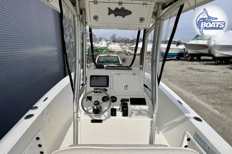 Slide: The Image of 2018 KenCraft Challenger 206 boat interior with steering wheel and control panel. - 4