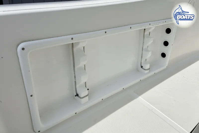 Slide: The Image of 2018 KenCraft Challenger 206 boat interior detail with rod holders and storage compartment. - 7