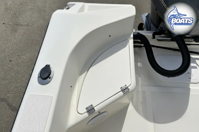 Slide: The Image of KenCraft Challenger 206 boat deck, 2018 model, featuring storage compartment and engine details. - 8