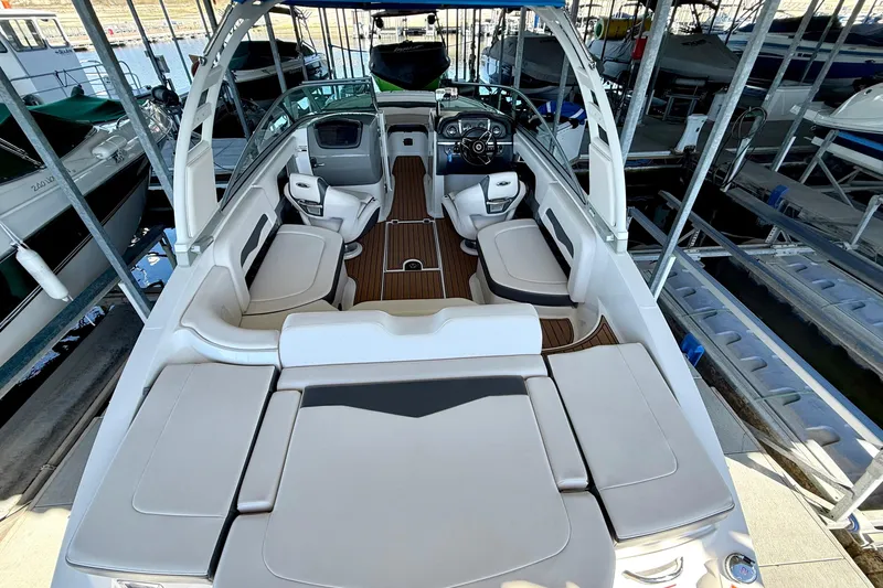 Slide: The Image of 2017 Chaparral 246 SSi boat interior with spacious seating and modern dashboard. - 17