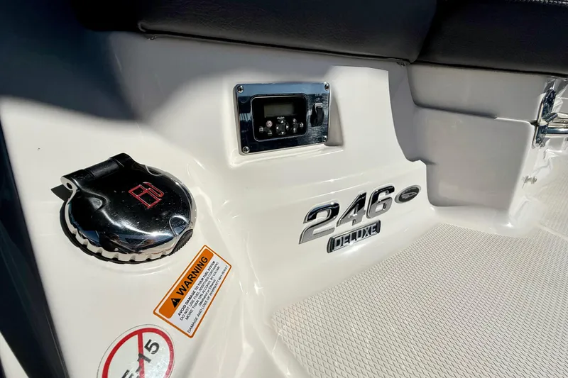 Slide: The Image of 2017 Chaparral 246 SSi boat interior with control panel and warning label. - 30