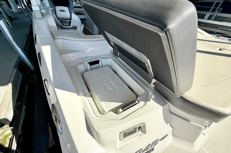 Slide: The Image of 2017 Chaparral 246 SSi boat interior with Igloo cooler storage compartment. - 32