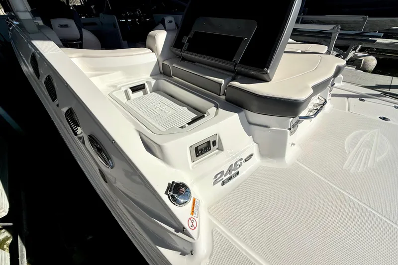 Slide: The Image of 2017 Chaparral 246 SSi boat interior with seating and storage compartments. - 34