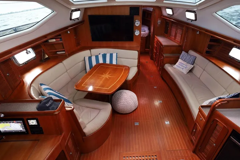 Slide: The Image of Luxurious interior of 2009 Passport Vista 515 Center Cockpit yacht with elegant wood finish. - 11