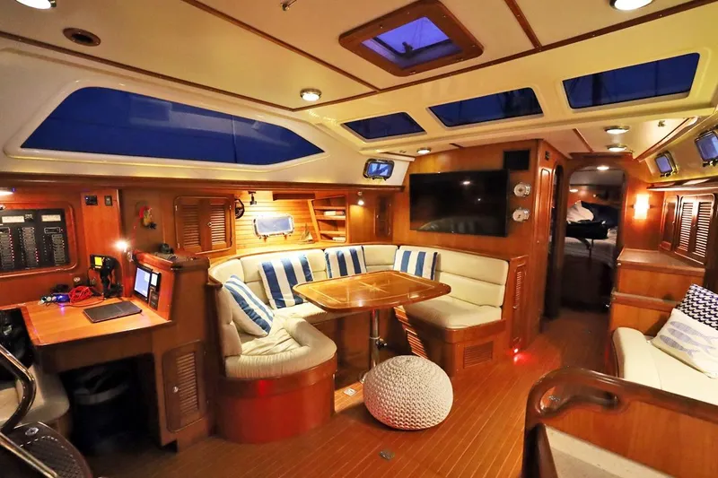 Slide: The Image of Luxurious interior of 2009 Passport Vista 515 Center Cockpit yacht with elegant seating and modern amenities. - 12