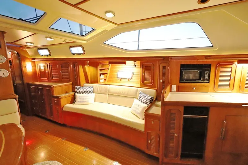 Slide: The Image of Luxurious interior of 2009 Passport Vista 515 Center Cockpit yacht with elegant wood finish. - 16