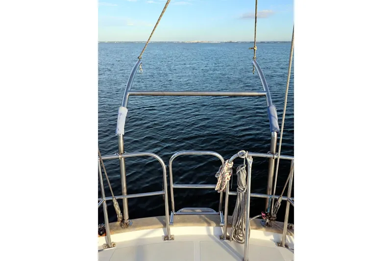 Slide: The Image of Sailing view from 2009 Passport Vista 515 Center Cockpit, overlooking calm ocean waters. - 6