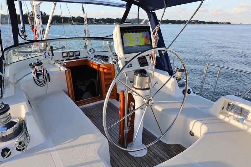 Slide: The Image of Center cockpit of 2009 Passport Vista 515 sailboat with steering wheel and navigation equipment. - 9
