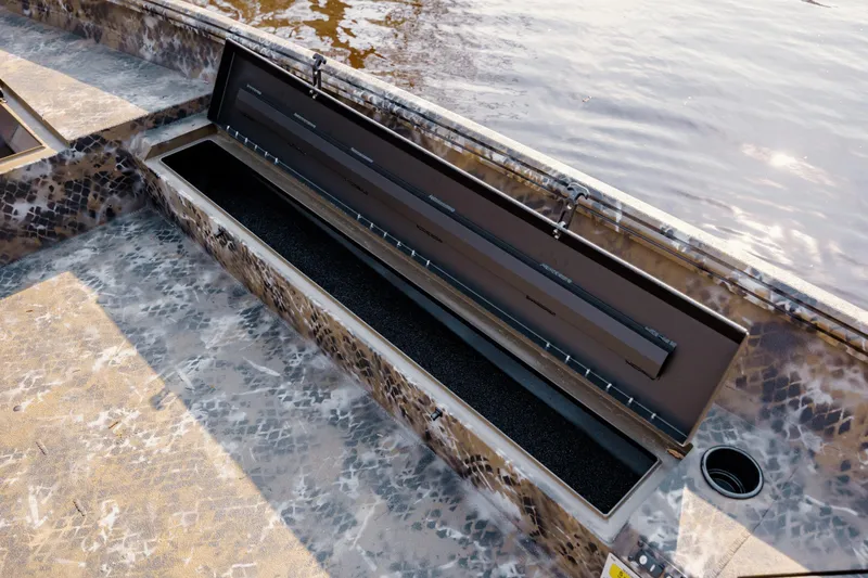 Slide: The Image of Open storage compartment on 2026 Excel 183 Tomahawk boat with camouflage pattern. - 22