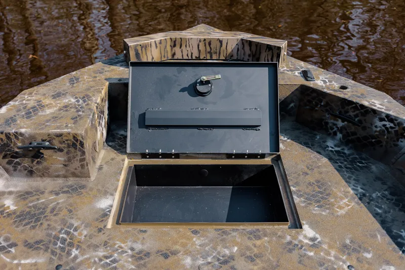 Slide: The Image of Open storage compartment on 2026 Excel 183 Tomahawk boat with camouflage design. - 29