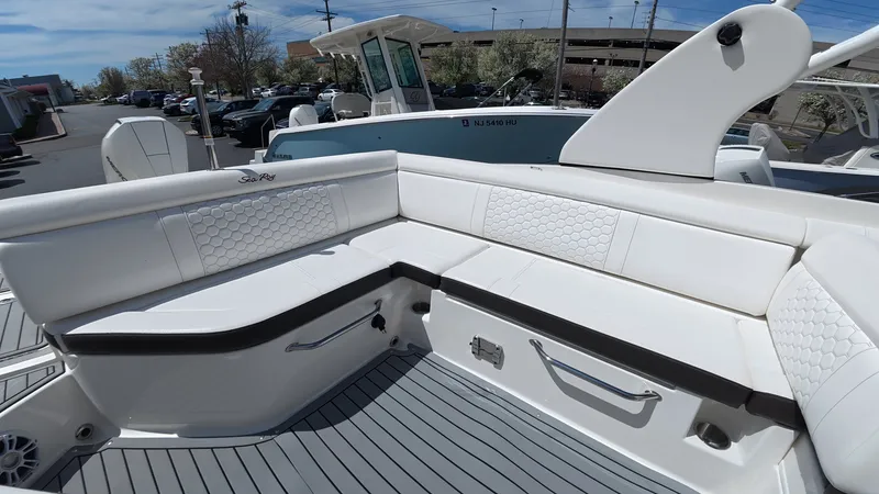 Slide: The Image of Interior of 2020 Sea Ray SDX 270 Outboard with white upholstery. - 12
