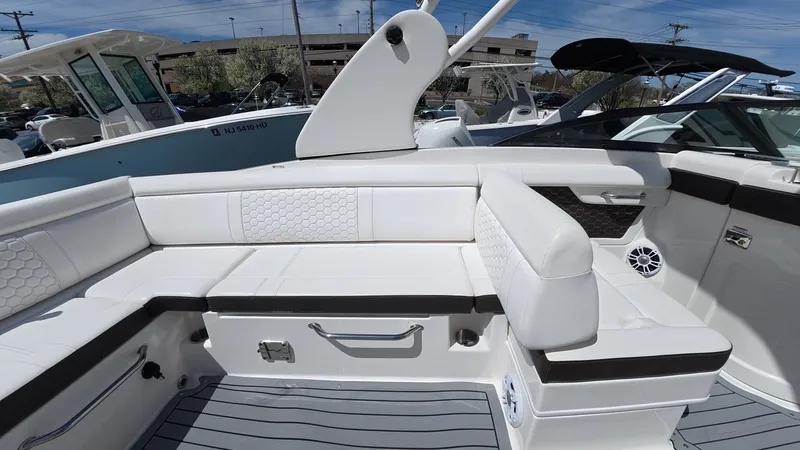 Slide: The Image of Interior of 2020 Sea Ray SDX 270 Outboard with white upholstery. - 13