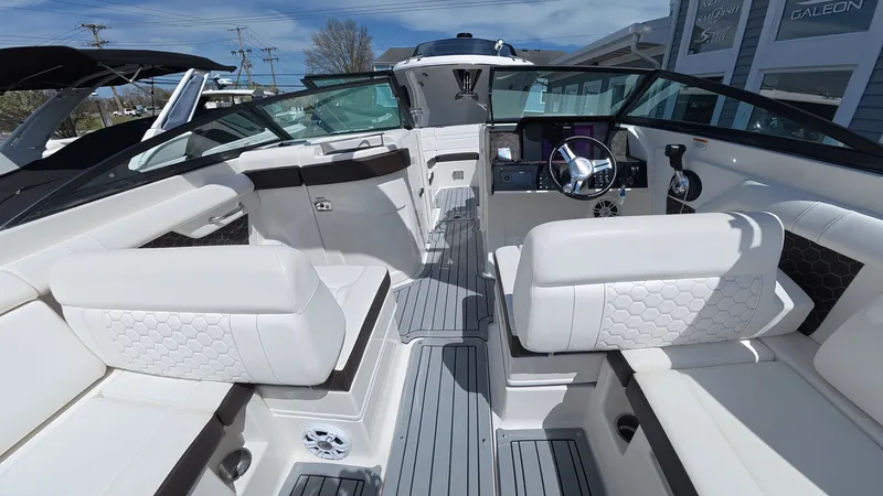 Slide: The Image of Interior of 2020 Sea Ray SDX 270 Outboard with luxurious white seating. - 16