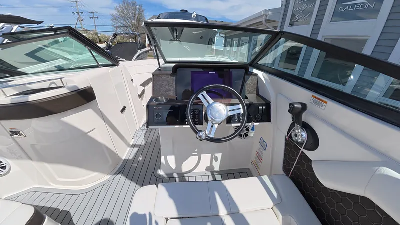 Slide: The Image of Interior view of 2020 Sea Ray SDX 270 Outboard with modern helm. - 19