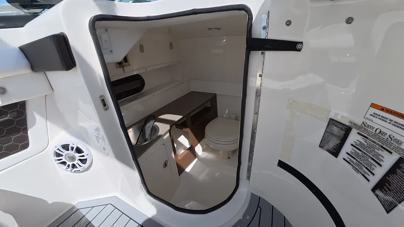 Slide: The Image of Interior of 2020 Sea Ray SDX 270 Outboard with toilet. - 23