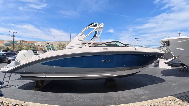 Slide: The Image of 2020 Sea Ray SDX 270 Outboard boat on a parking lot. - 4