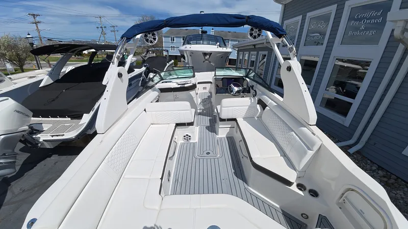 Slide: The Image of 2020 Sea Ray SDX 270 Outboard with luxurious interior and blue sunshade. - 9