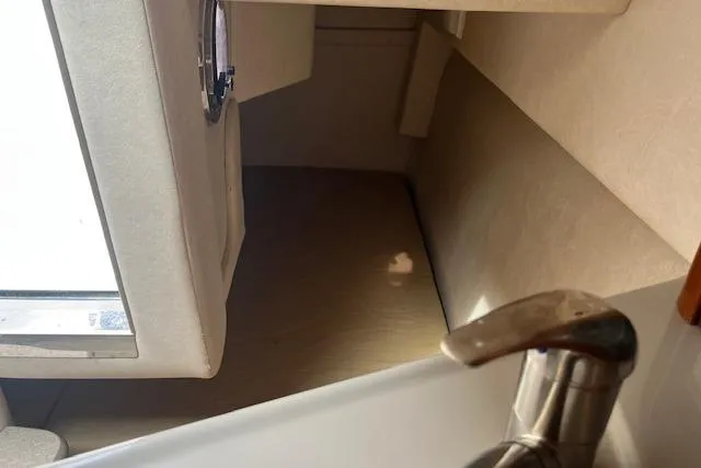 Slide: The Image of Interior cabin view of a 2008 Sea Ray 240 Sundancer boat. - 15